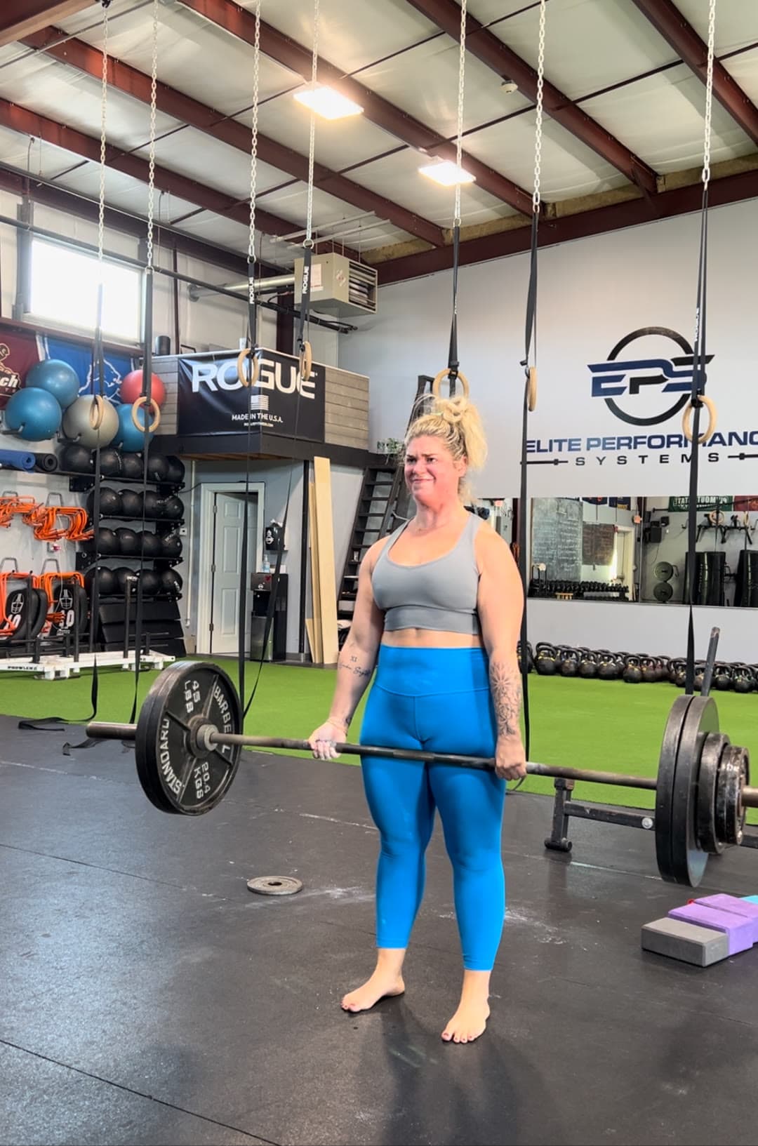 An EPS member deadlifting in the gym